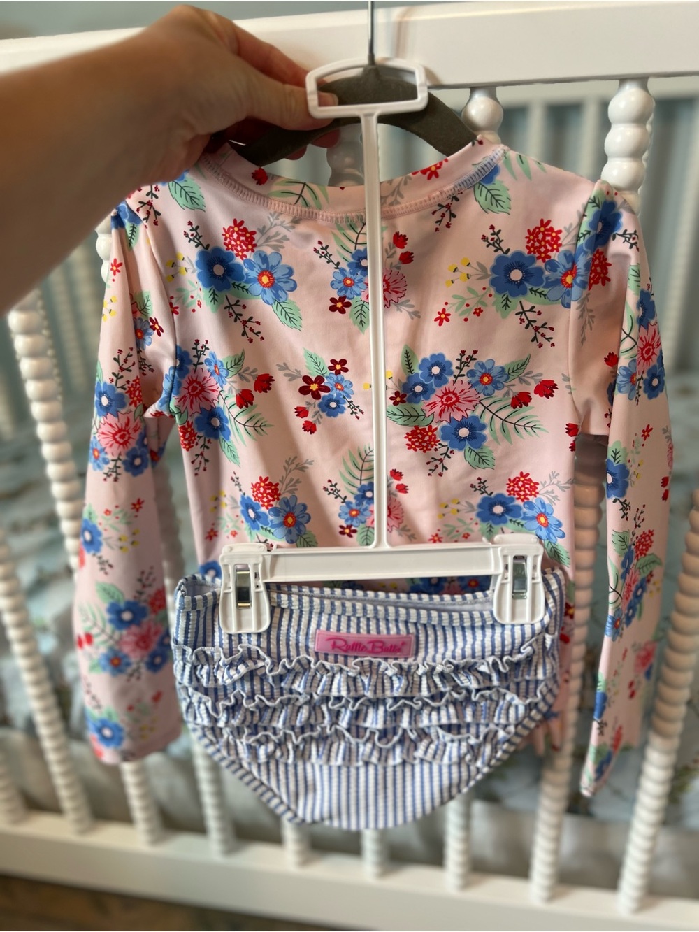 Pink floral rash guard with striped bottoms